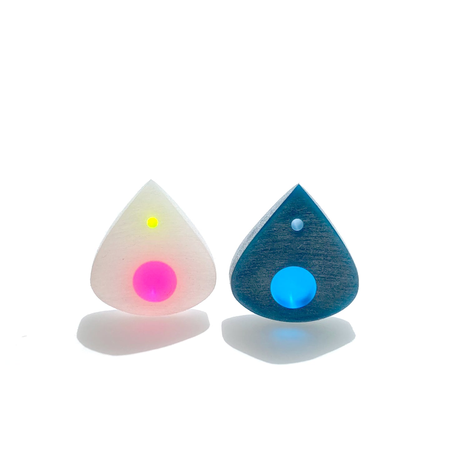pair of guitar picks with multicolor optics