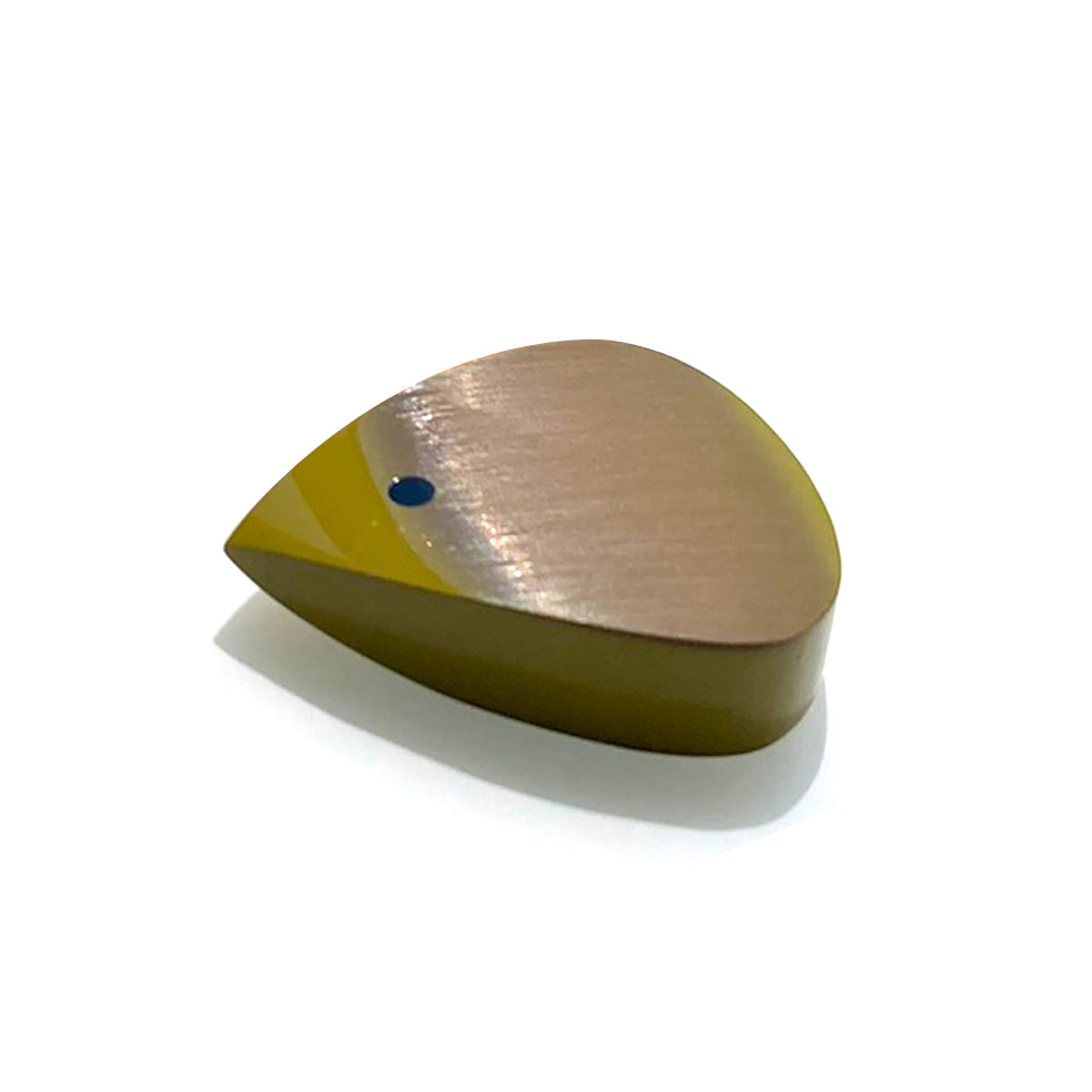 big yellow guitar pick bathed in sunlight