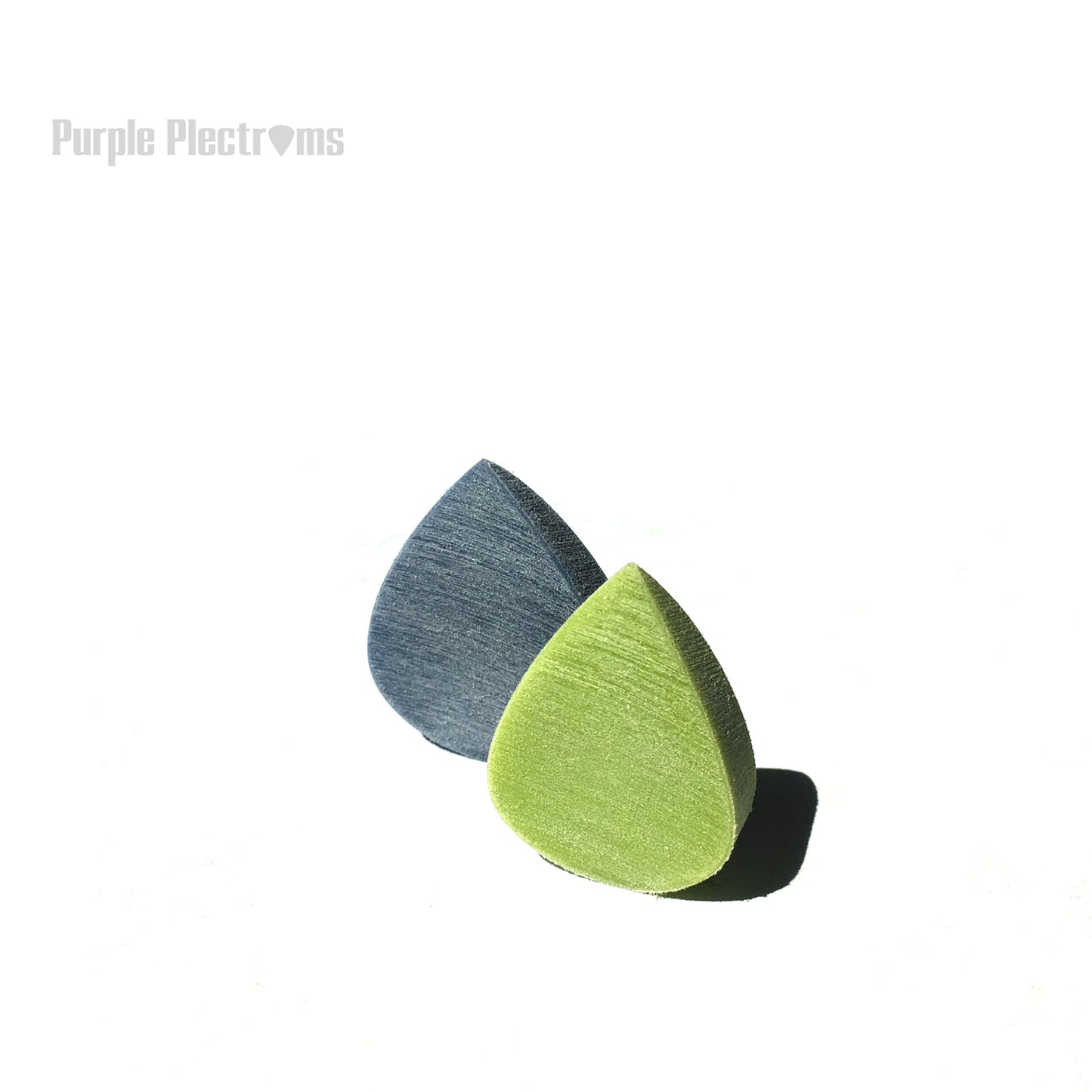 pair of blue and green picks against a white background