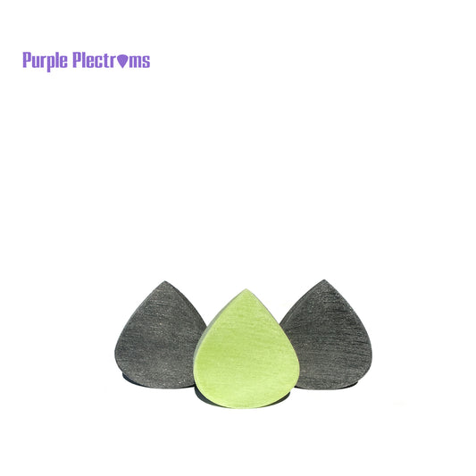 trio of big guitar picks against a white background