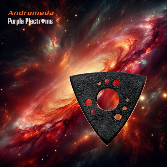 triangular guitar pick with swirling galaxy design against a backdrop of a galaxy picture