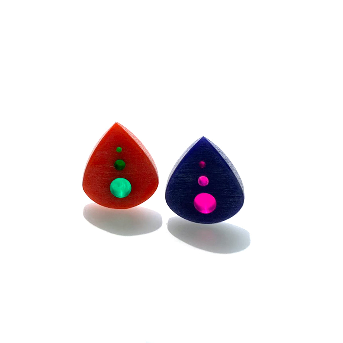 pair of beautiful small guitar picks in orange and purple with green and pink optics