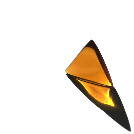 amber color triangular guitar pick