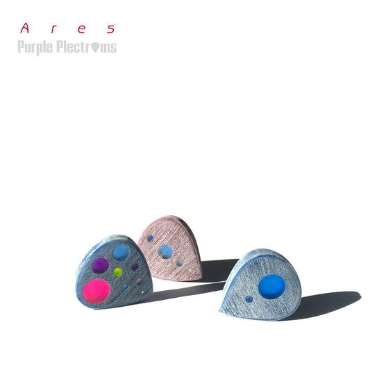 trio of small colorful guitar picks