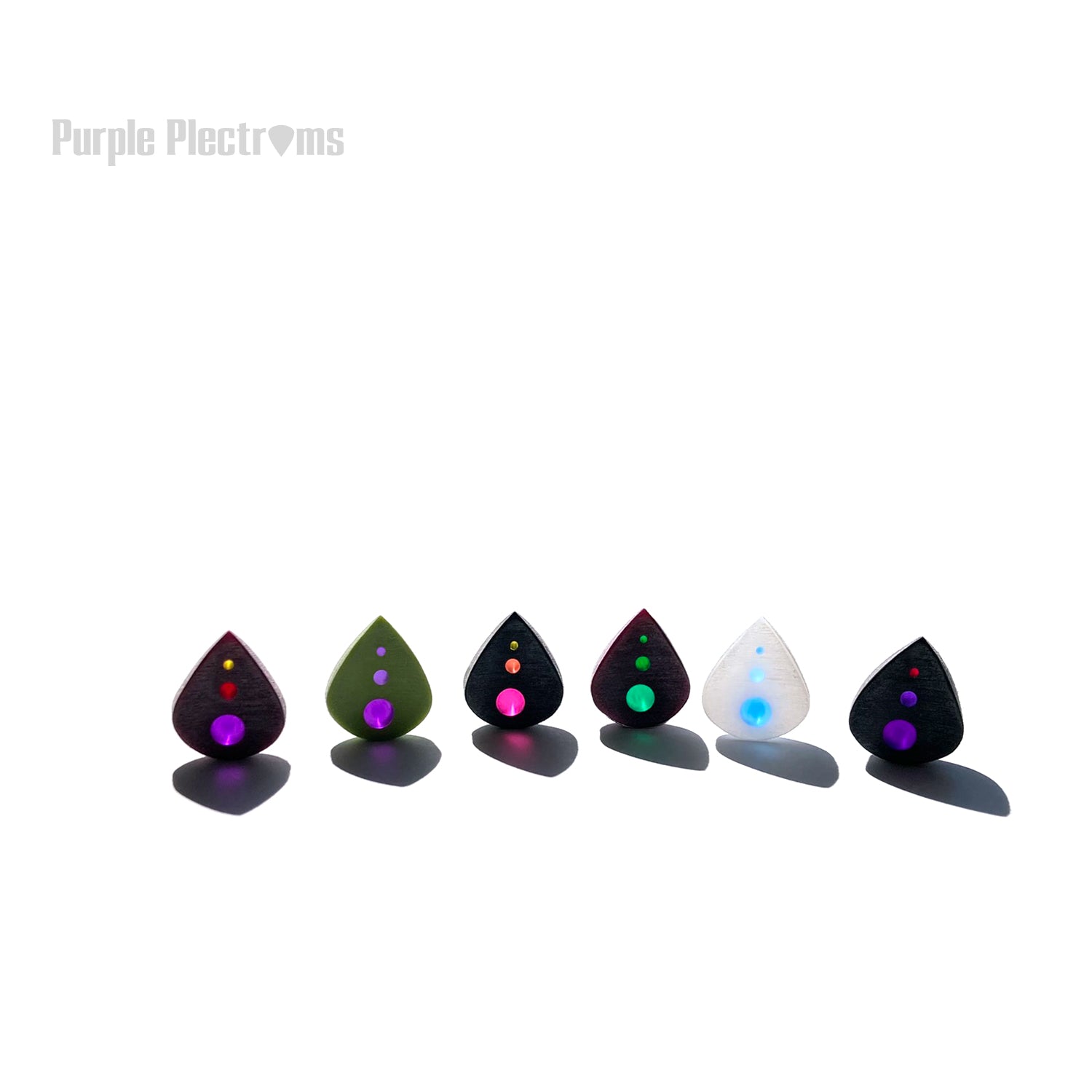group of small guitar picks standing with multicolor optics