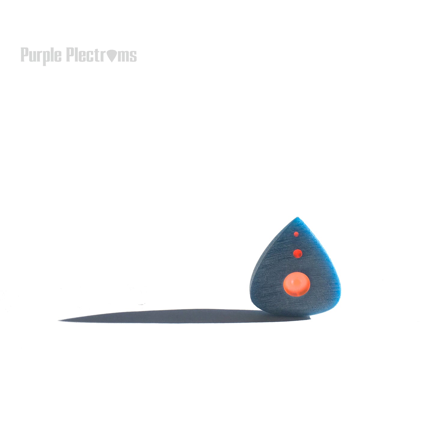 blue pick with orange inserts bathed in sunlight