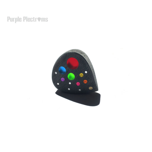 Guitar pick with multiple color optic inlays designed to represent the solar system
